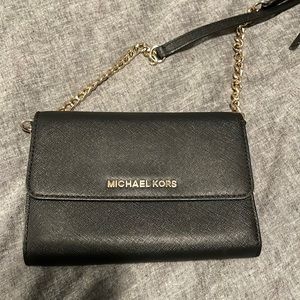 Black crossbody Michael Kors purse